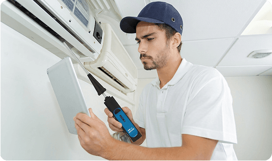 Technician using a Blü-Test probe on HVAC equipment