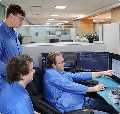 BAPI engineering team reviewing data on monitors